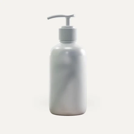 A white pump bottle with a printed label applied